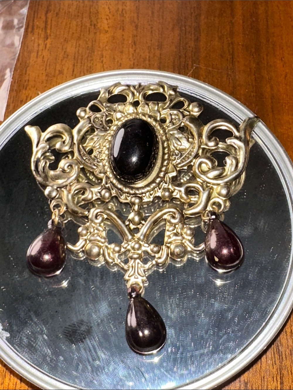 Ornate Gold-Tone Brooch with Black Cabochon Drops